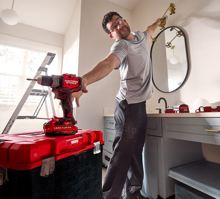 Man reaching for drill
